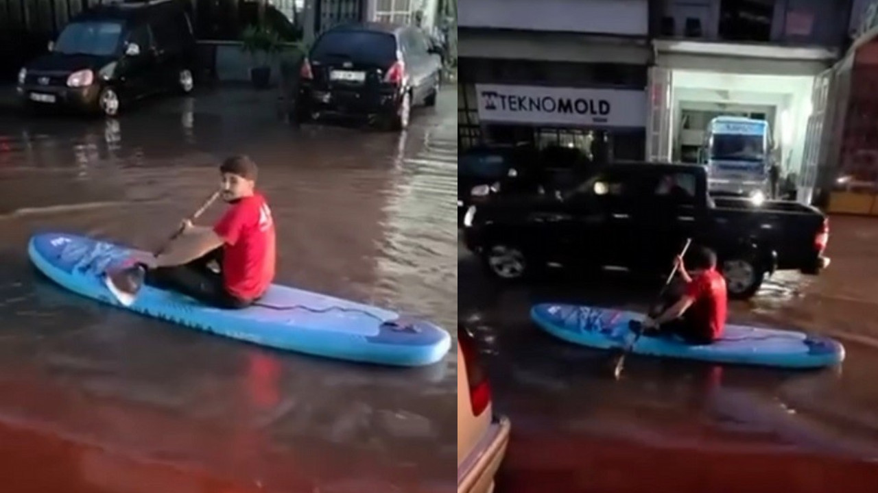 Sakarya'da su basan sokakta vatandaş SUP tahtasıyla gezintiye çıktı