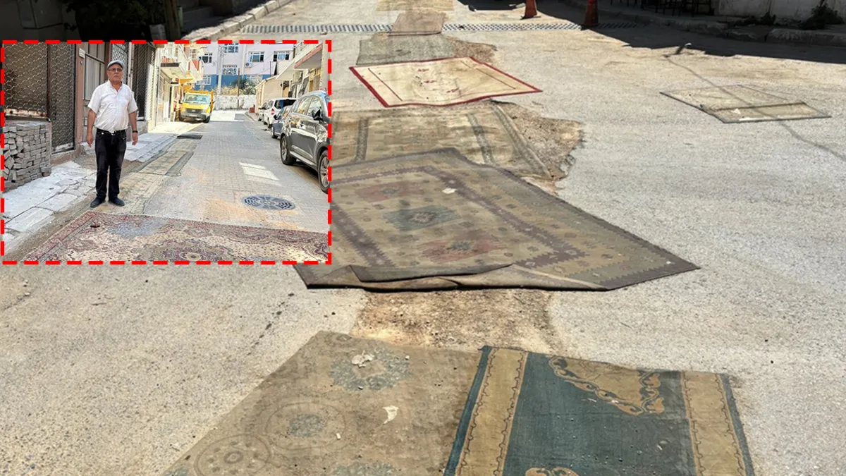 İzmir Konak'ta onarılmayan yollar nedeniyle mahalleli sokaklara halı serdi